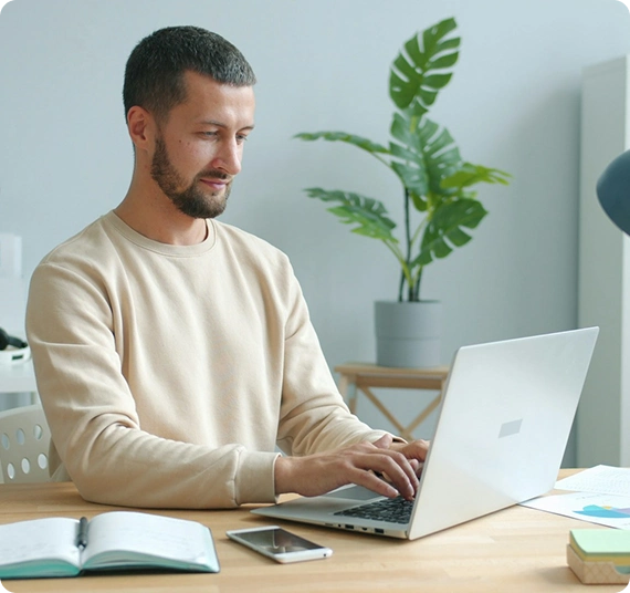 Men typing on laptop